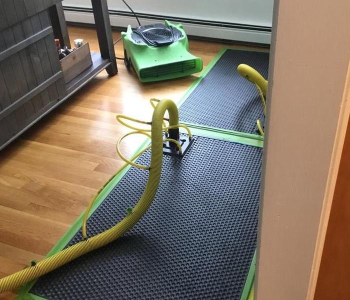SERVPRO equipment on the floor of a home. 